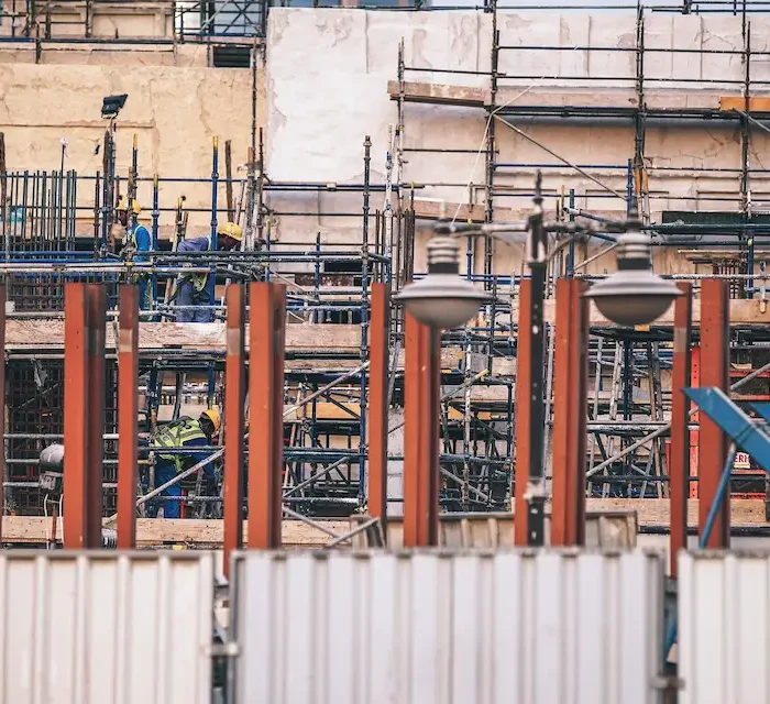Commercial structure covered with modular scaffolding installed by Ontario Scaffolding for long-term construction access.