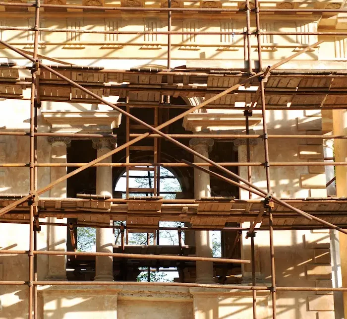 Historic building facade supported by professional scaffolding installed by Ontario Scaffolding for exterior restoration work.
